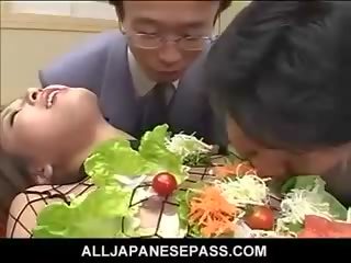 Jepang av model turned into an edible table for hard up juveniles